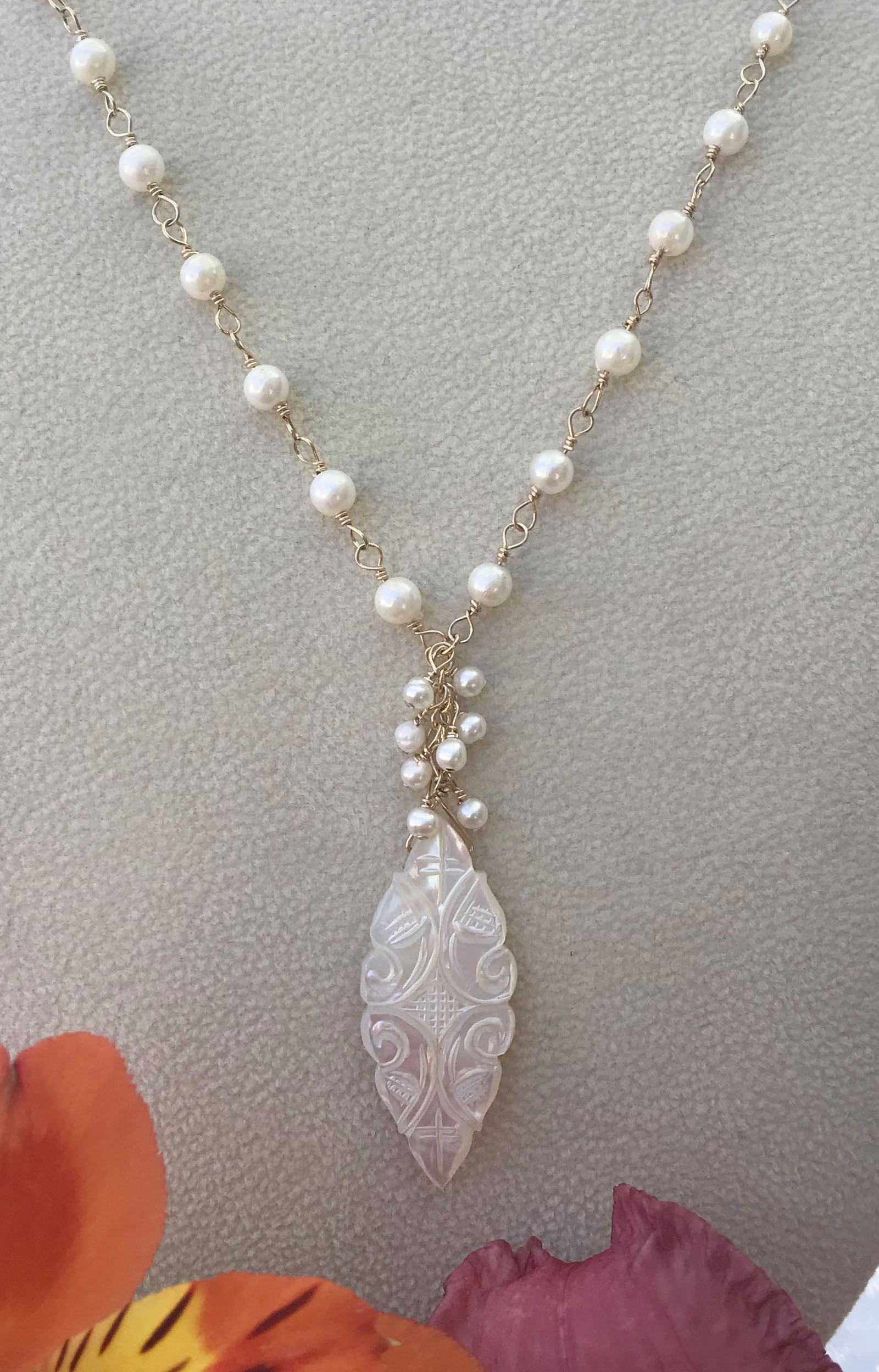 Carved mother of pearl pendant online